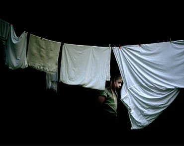 Julia Peirone, Girl behind laundry, 2003
